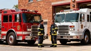 Fire trucks and firefighters from two departments.
